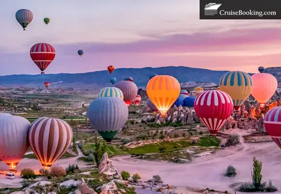 Colorful hot air balloons over rocky landscape