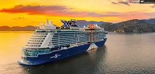 Celebrity Xcel Large cruise ship sailing at sunset