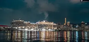 MSC Bellissima docked in the night harbor lights