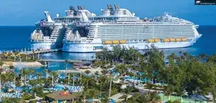 Oasis and Symphony of the Seas ship docked at pier