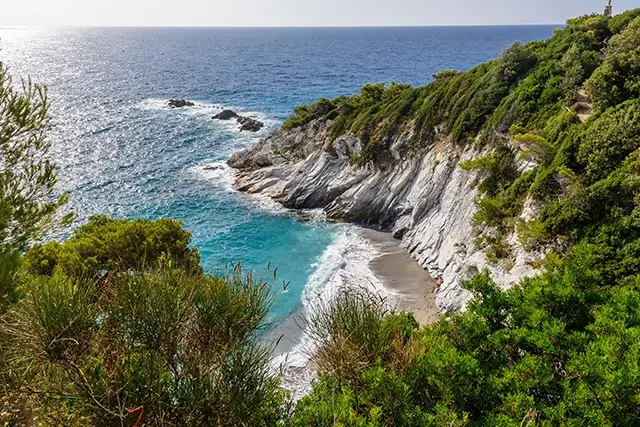 view of the coast of Bergeggi beach from the sea