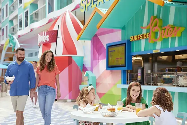 Icon of the Seas, a family having lunch at Surfside Bites, fast food, kids at the table, parents approaching,