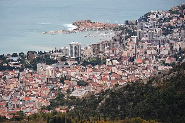 Aerial view of city with skyscrapers, harbor