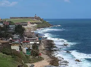 A panoramic view of Castillo San Felipe del Morro, a historic fort overlooking the ocean in San Juan, Puerto Rico.