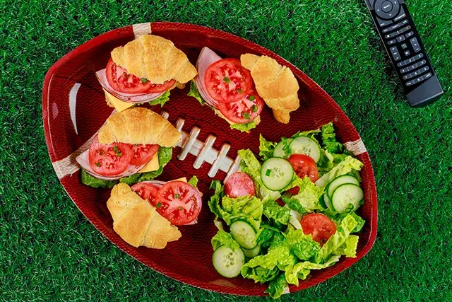Football party appetizers with TV remote controllers