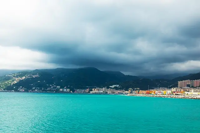 Cloudy and mountainous Genoa, an Italian seaport