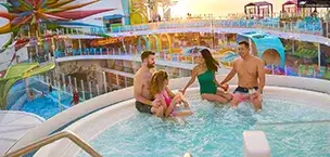 Icon of the Seas Two couples relaxing in a Hot Tub